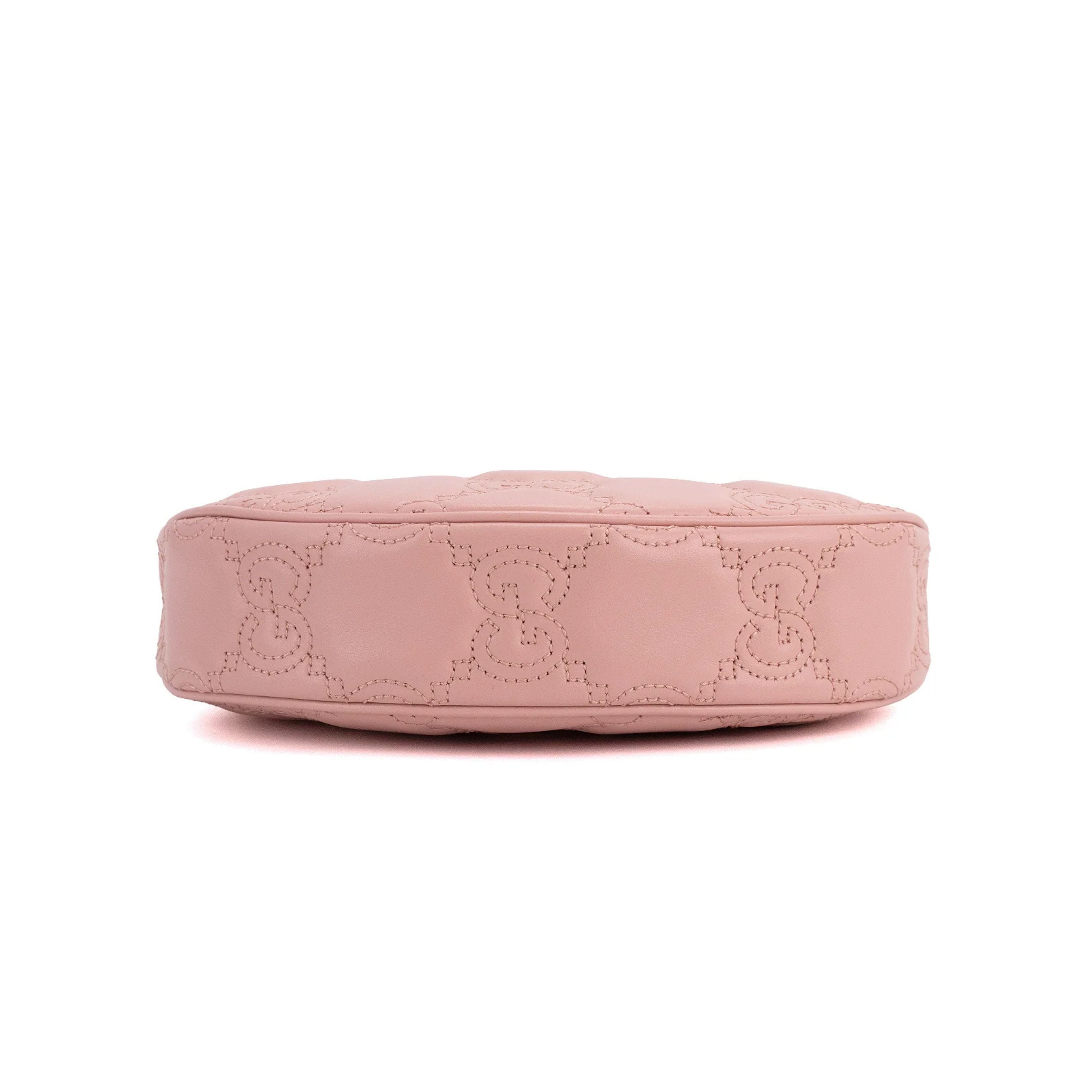 Gucci Sac à bandoulière en cuir matelassé GG rose